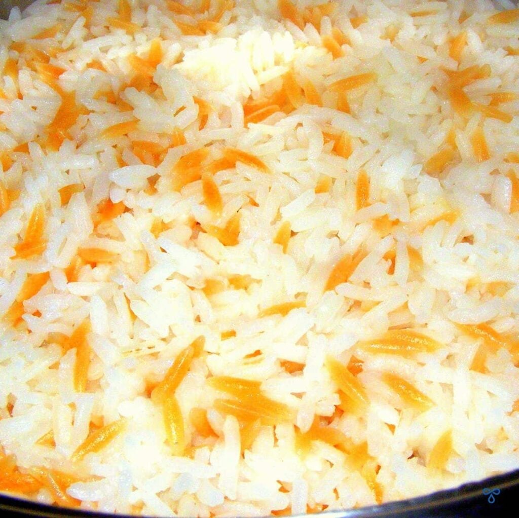 A serving of Turkish Rice. The close up shows a mix of the white rice grains and the brown orzo.